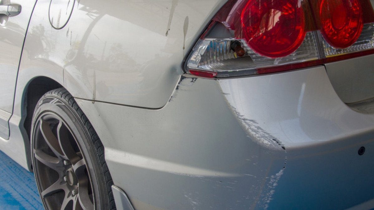 Scrapes run along the rear bumper of a silver sedan, damage car accident attorneys in Summerville study after rear end crashes