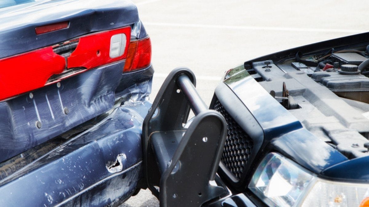 A pickup bumper guard is pressed into a dented sedan trunk, a rear impact car accident lawyers in Berkeley County often review