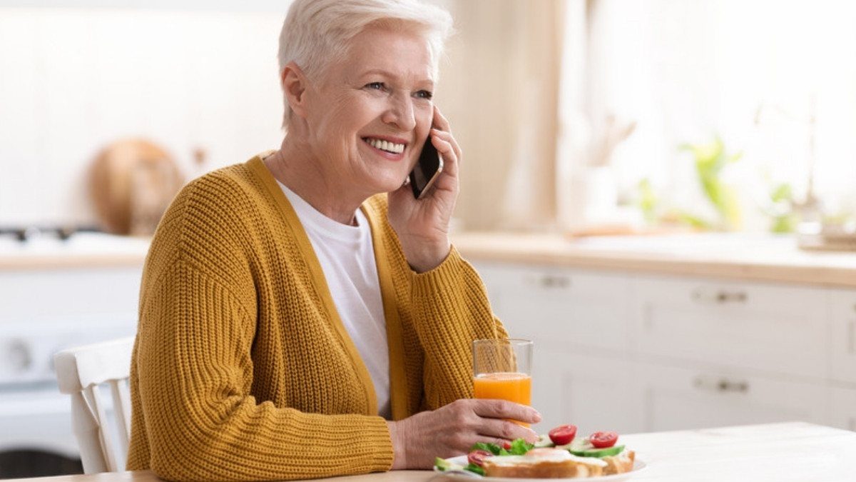 Over breakfast at her kitchen table, a woman makes a phone call, a relaxed way to start with Goose Creek car accident lawyers