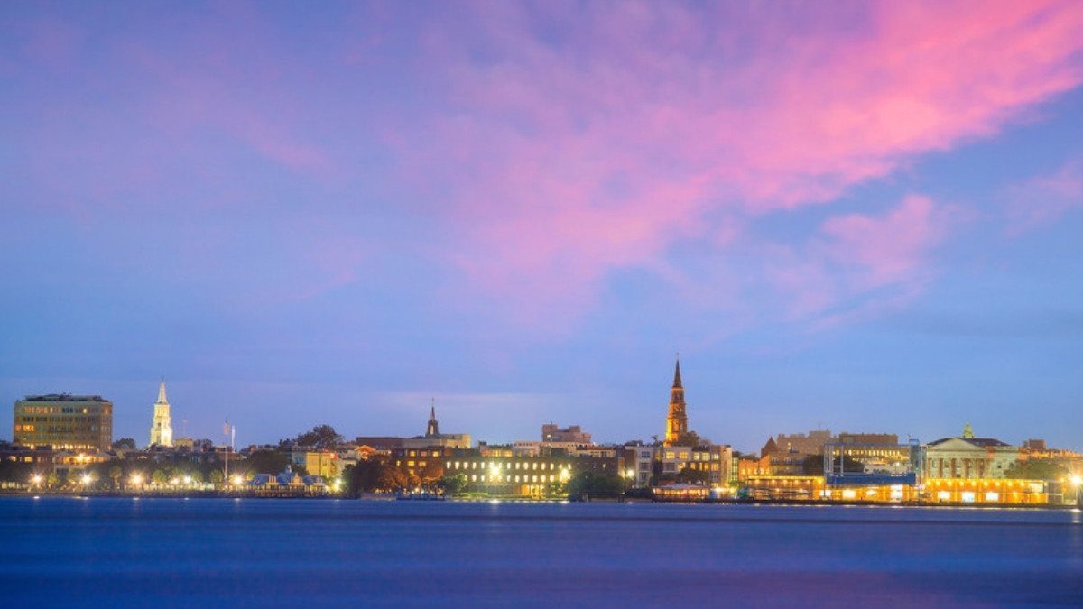 The Charleston skyline glows across the harbor at dusk, a familiar view for personal injury attorneys in Charleston County