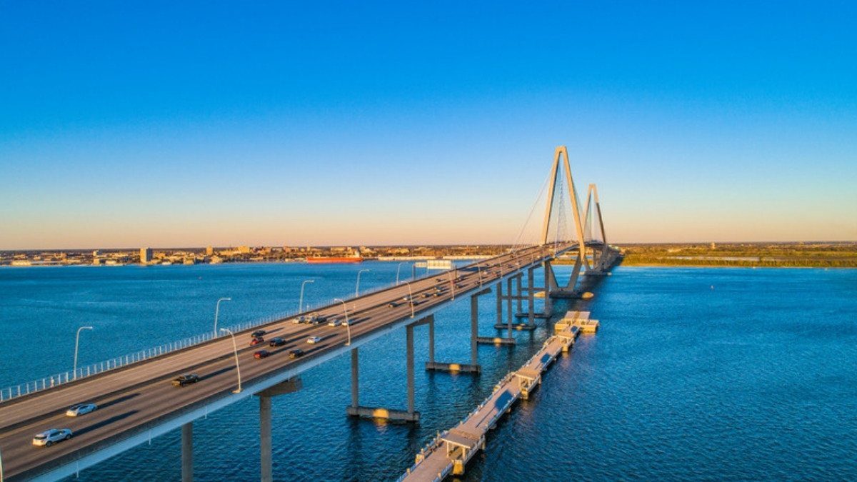 Traffic crosses the Ravenel Bridge over the Cooper River in evening light, part of the US 17 corridor through Charleston County