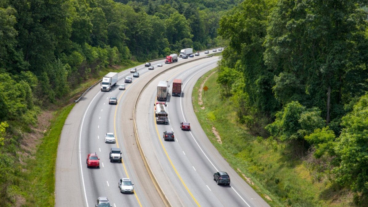 Cars and trucks travel a wooded divided interstate, a stretch personal injury attorneys in Colleton County see in many crash reports