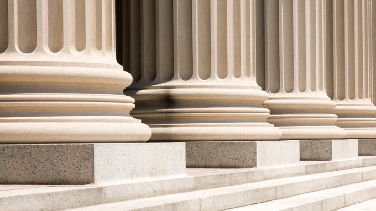 Fluted stone columns stand over broad courthouse steps like those personal injury attorneys in Dorchester County climb to file a claim