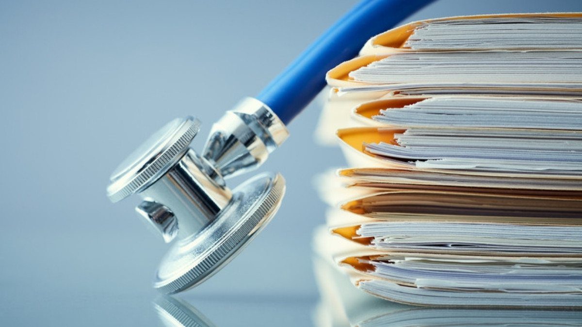 A stethoscope rests on a tall stack of patient files, records personal injury attorneys in Orangeburg County request after a crash