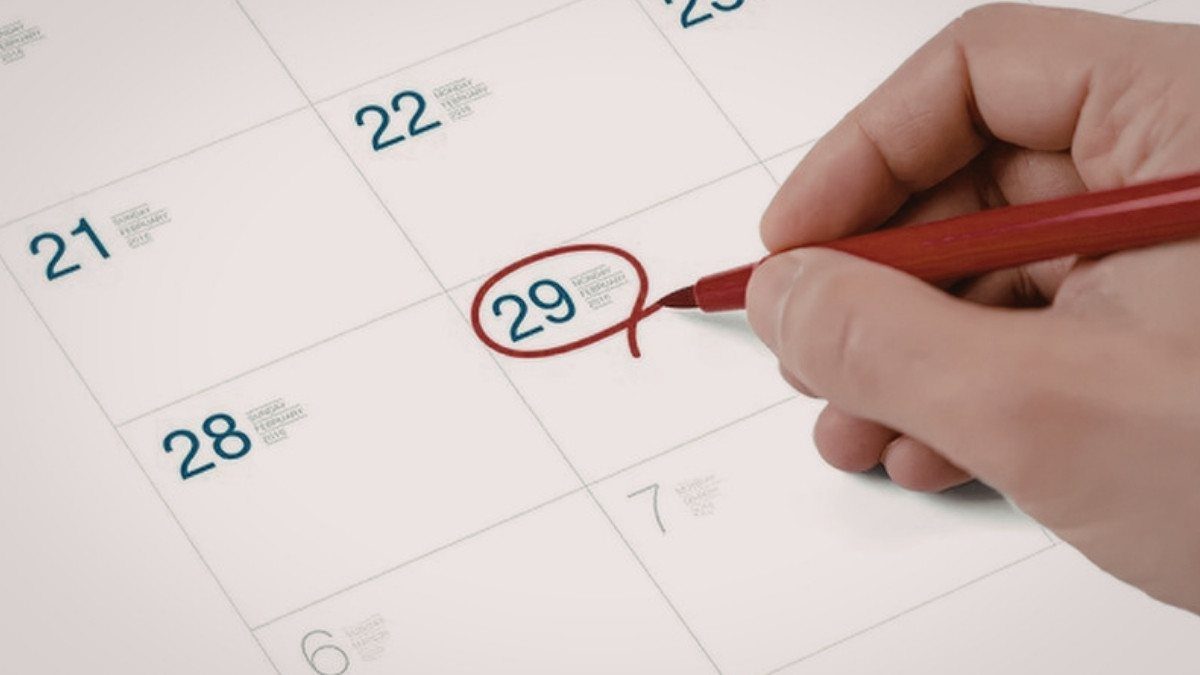 A hand circles the 29th on a calendar page in red ink to keep track of a records request and a filing deadline