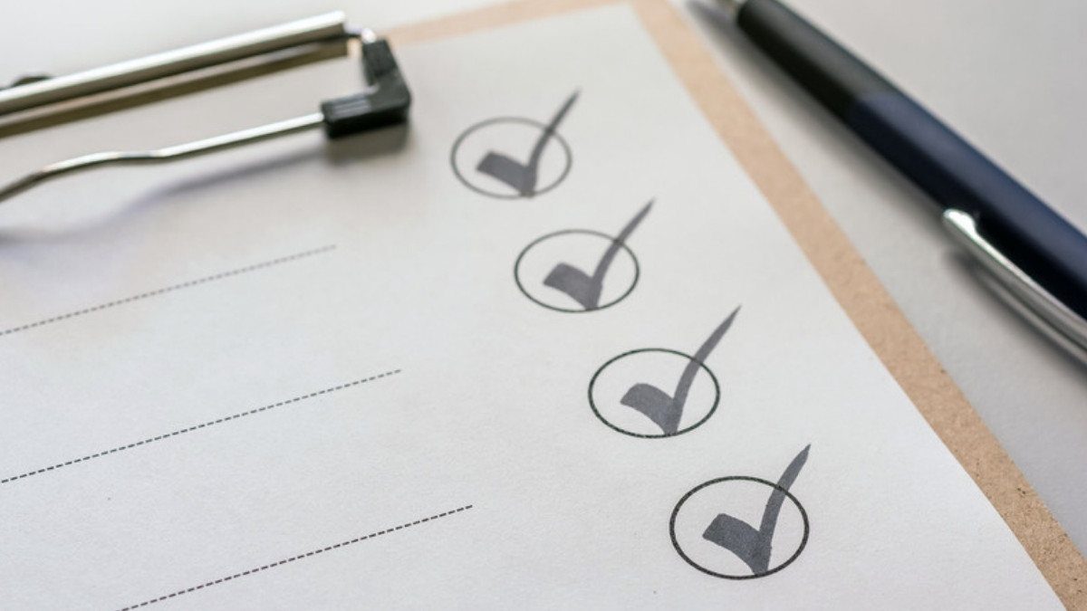 Check marks fill a clipboard list, much like the screening file rideshare accident attorneys in Summerville may ask to see