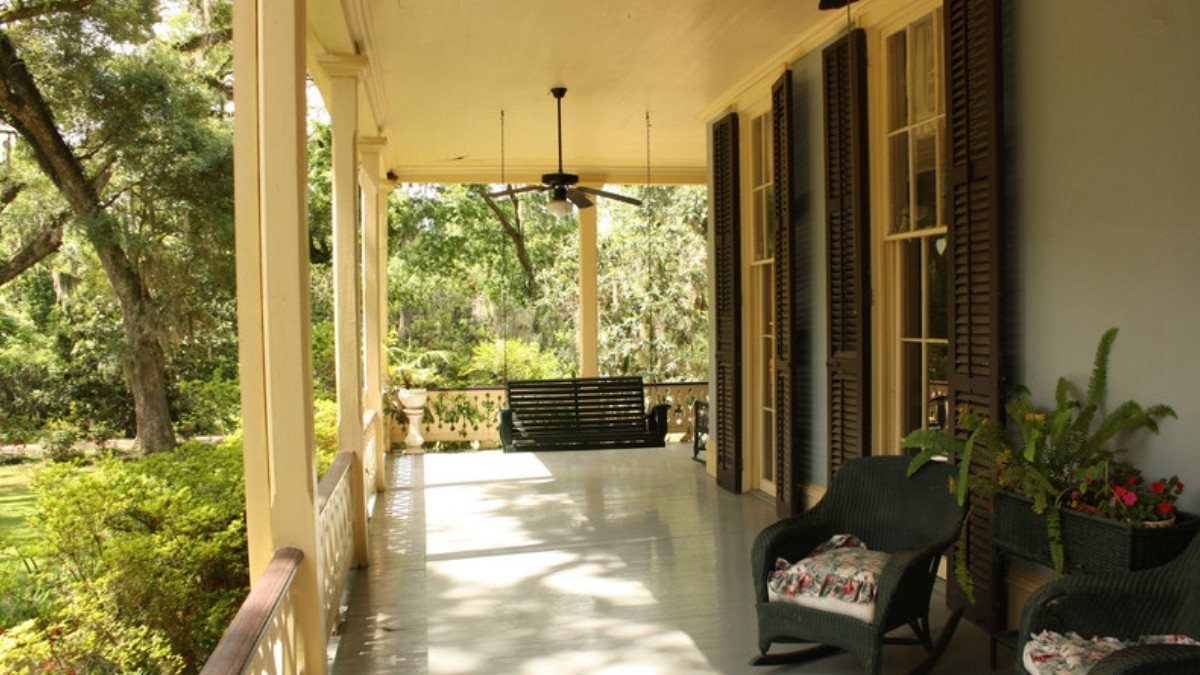 A shaded porch with rocking chairs looks out on moss covered oaks, a quiet place to think over South Carolina car accident laws